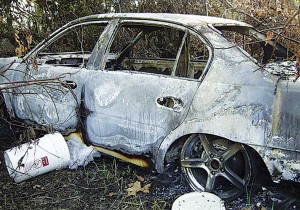 The burnt car in which the remains of Henry Glover were found.