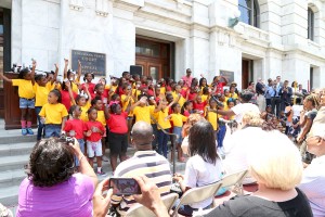 Young members of Tambourine and Fan, shown above, embody the hope and energy of the Civil Rights Movement as they celebrate the Civil Rights Acts 50th Anniversary on the steps of the Louisiana Supreme Courthouse, Wednesday, July 2.  Photo by Dennis Joseph