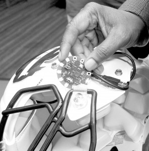 Dr. Gary Harris hopes to improve the way the Howard University Bison football team combats concussion, using this ‘Lilypad’ Arduino chip to measure impact during games. Photo courtesy Howard University