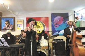 Jane Harvey Brown, center, with the Trad Jazz Stars, including From left to right, t Joe Cushenberry, guitarist; Kerry Brown, drummer; and Darrel “Sugar Bear” Francis, bassist.