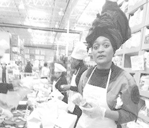 Renette Dallas got a hand from several of her employees last week during a four-day customer demonstration of her product, Life by Dallas Popcorn, at a Lanham, Maryland, Costco store. Photo by Avis Thomas-Lester/The Washington Informer