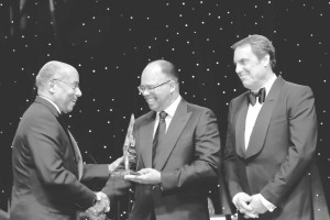 General Motors Vice President Global Design Ed Welburn (left) receives the 2015 Black Engineer of the Year award from GM Board of Directors member Errol Davis (center) and GM Executive Vice President Global Product Development Mark Reuss at the BEYA Conference Black Engineer of the Year Gala, Saturday, February 7, in Washington, DC.  Photo by Tony Powell for General Motors