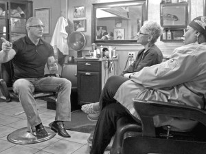 ‘Restaurant Impossible’ host Robert Irvine talks with owners of the JuJu Cafe and Barber Salon, Phyllis Johnson and Tommye Myrick. Photo courtesy of Food Network