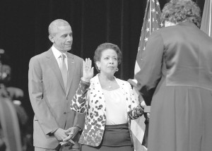 Loretta Lynch being sworn in by Associate Supreme Court Justice Sonia Sotomayor as President Obama looks on.  Freddie Allen/NNPA Photo