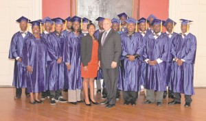 New Orleans Mayor Mitchell J. Landrieu and Ashleigh Gardere, Sr. Advisor to Mayor Mitch Landrieu and executive director of the Network for Economic Opportunity, stand with the 2015 graduates of Strive NOLA, a city-run program designed to hone the skills of disadvantaged residents and ready them to enter the workforce.