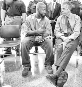 Education Secretary Arne Duncan speaks with a participant in the Goucher College Prison Education Partnership at the Maryland Correctional Institution.  (Flickr/Department of Education/CC BY 2.0)