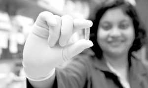 A diabetes pill under development could do away with needles by delivering insulin via a capsule filled with mucoadhesive patches. 'People take insulin several times a day and delivery by needles is a big challenge,' says Samir Mitragotri. Above, Amrita Banerjee holds a capsule.