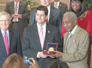 The Rev. Frederick Douglas Reese accepted the Congressional Gold
Medal on behalf of the 1965 Selma-to-Montgomery marchers from House Speaker Paul Ryan, who along with Senate Majority Leader
Mitch McConnell, to Ryan’s right, are refusing to advance legislation
restoring provisions of the Voting Rights Act struck down by the U.S. Supreme Court.