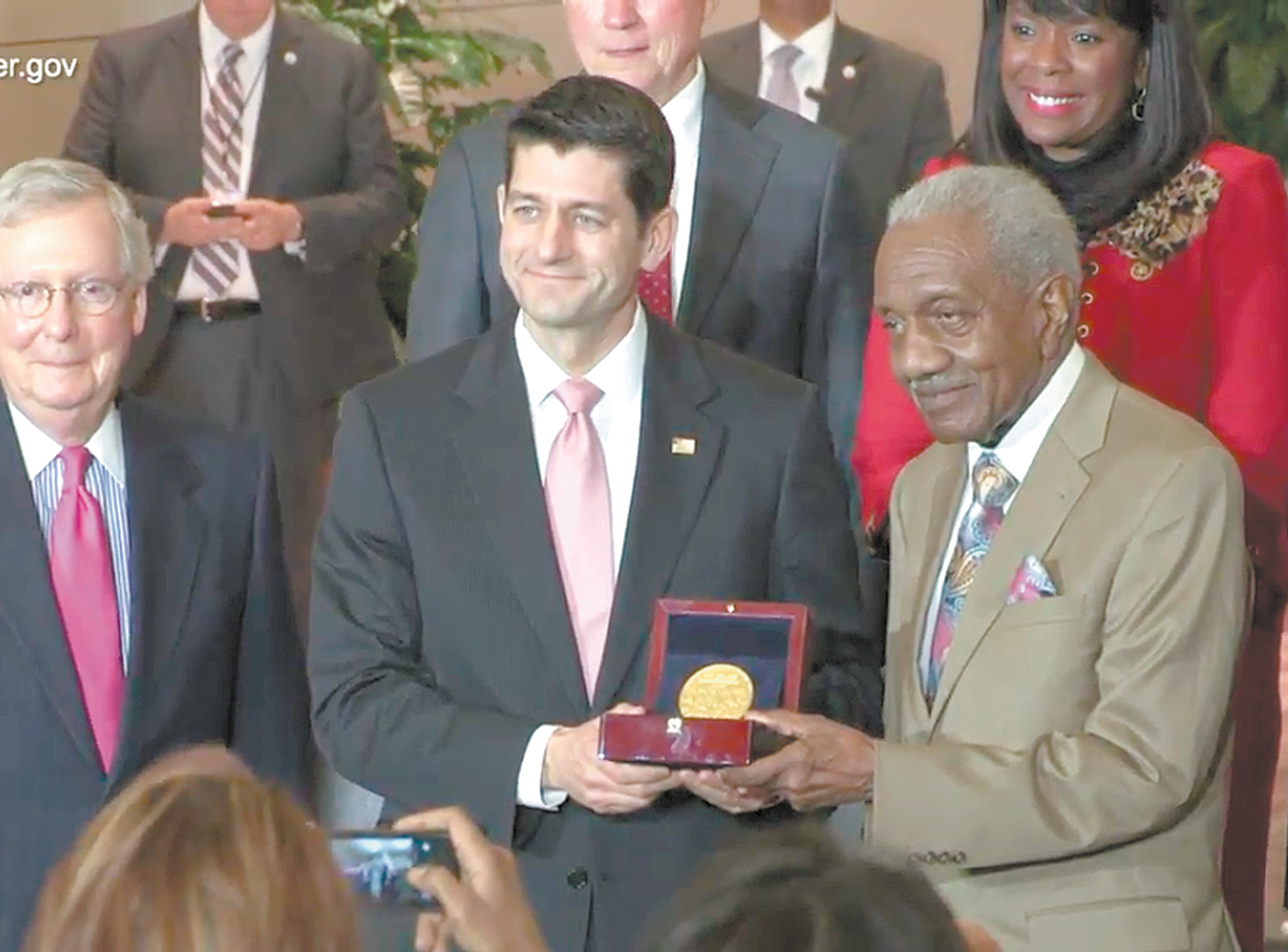 The Rev. Frederick Douglas Reese accepted the Congressional Gold Medal on behalf of the 1965 Selma-to-Montgomery marchers from House Speaker Paul Ryan, who along with Senate Majority Leader Mitch McConnell, to Ryan’s right, are refusing to advance legislation restoring provisions of the Voting Rights Act struck down by the U.S. Supreme Court.