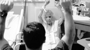 Willie Mae Rich exercises with nurse Andres Viles, who keeps elderly patients mentally and physically active at Birmingham hospital.