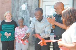 Owner Burnell Cotlon, center, opens the Lower Ninth Ward Laundromat at a ribbion cutting on Sept. 15 with his mother Lillie Mae Cotlon, second left; Councilman James Gray II, second from right; and Cotlon's wife, Keisha, at right.