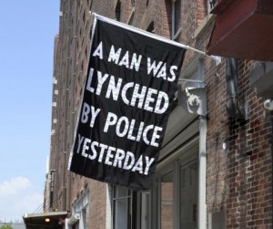 Dread Scott’s flag, “A Man Was Lynched By Police Yesterday,” on view at Jack Shainman Gallery (2016). Photo courtesy of the artist and Jack Shainman Gallery.