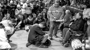 Veteran Wes Clark Jr. kneels before Chief Leonard Crow Dog and Ivan Looking Horse and asks for forgiveness for the U.S. military's mistreatment of Native Americans.