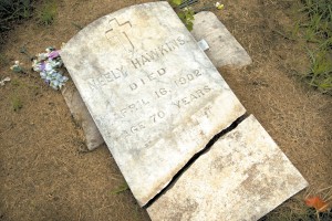 In this June 30, 2016 photo, the gravestone of Cornelius "Neely" Hawkins, one of the slaves in Georgetown University's 1838 slave sale, is seen in Immaculate Heart of Mary Catholic Cemetery in Maringouin, La.