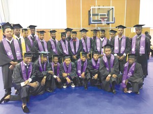 The "W-E 23" —23 Warren Easton Charter High School seniors — pose with their Residential Electrician Certificate of Technical Studies after they were awarded at Delgado Community College's Commencement ceremony on May 16.