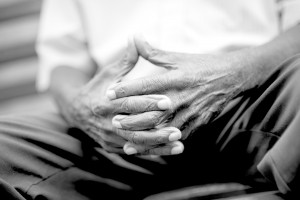 Elderly-man-clasping-hands-