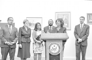 Rep. Maxine Waters (D-Calif.) speaks from the podium about The Megabank Accountability and Consequences Act. Waters is flanked by (from let-right) Reps. Keith Ellison (D-Minn); Marcy Kaptur (D-Ohio), Pramila Jayapal (D-Wash.); and Al Green (D-Texas)