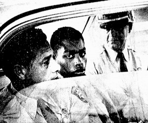 In this February 1964 photo, Henry Montgomery, flanked by two deputies, awaits the verdict in his trial for the murder of Deputy Sheriff Charles H. Hurt in Louisiana. Montgomery, a 71-year-old prisoner who was 17 when he killed a sheriff's deputy, learned Wednesday, June 21, 2017, that he would get a chance at parole, 54 years after the killing and a year after winning his appeal before the U.S. Supreme Court.