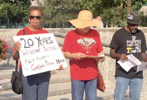 Gordon Plaza residents and activists Lydwina Hurst, Marilyn Amar and Jeffe Perkins stand in protest and remembrance