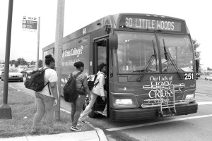 Students get on a Regional Transit Authority bus to travel to school.