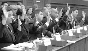 After hours of testimony before the House Finance Committee's Subcommittee on Housing, Community Development and Insurance, witnesses raise their hands in response to a question on whether homeownership discrimination against Blacks continues today.