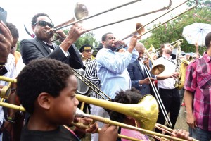 Corey Henry, Glen David Andrews and Troy "Trombone Shorty" Andrews lead the band at the second line for Art Neville.