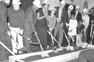 Principals and visonaries of the expanded African American Civil War memorial symbolically dig in the shovels. Pictured are Sarosh Olpadwada, economic developer; James Turneer ANC, Dr. Frank Smith, museum director and founder; Mayor Muriel Bowser; Councilperson Brianne Nadeau; Grant Epstein, project developer; Torti Gallas, developer tenant; Patrick Smith, economic developer; and neighbors Maya Hendricks and Mason Hendricks.