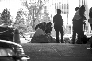 City workers remove a homeless man's tent during a weekly encampment sweep.