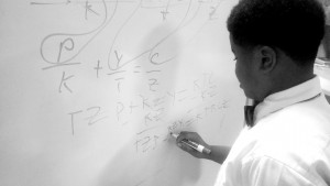 T.M. Landry 5th grader D' Myrie Clay completes algebra problem for high school peers