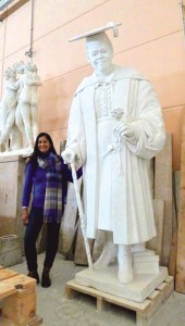 Master carver Nilda Comas stands next to her creation, a statue of Mary McLeod Bethune.