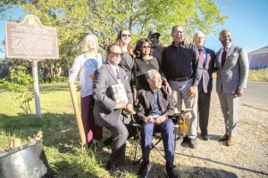 Members of the Board of Directors of the Plessy Ferguson Foundation congregated at the site of Homer Plessy's historic 1892 arrest for a commemorative tree planting on Nov. 30, 2021. (Seated) Keith Weldon Medley; (Second Row) Keith Plessy, Phoebe Ferguson, Teresa Kenny, Brenda Billips Square, Dr. Raynard Sanders, Ron Bechet, French Ambassador Phellipe Etienne and District Attorney Jason Williams. Photo by Audoin de Vergnette, courtesy of the Consulate General of France in Louisiana .