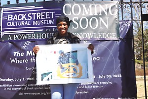 Dominique Dilling-Francis, Executive Director of The Backstreet Cultural Museum, stands in front of the meseum's new home located at 1114 North Villere Street. Dilling-Francis, the daughter of Museum's founder, the late Sylvester Francis, signed a one-year lease to rent one of the houses belonging to the African American Museum. Photo by Demian Roberts