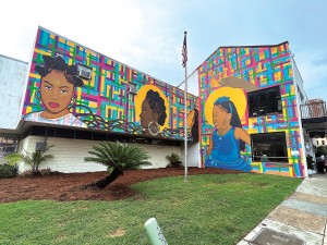 A mural dedicated to the Crown Act is the creative work of Journey Allen and is located at 633 Carondelet Street. Photo by Amandi J. Rock